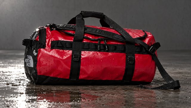 The red duffel on wet concrete after a skid