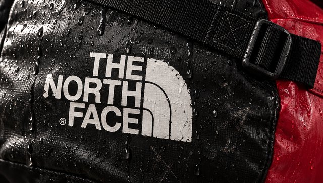 The wet black end panel with the printed logo